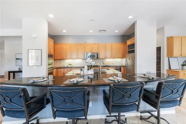 a spacious bathroom with a double vanity sink mirror and bathtub