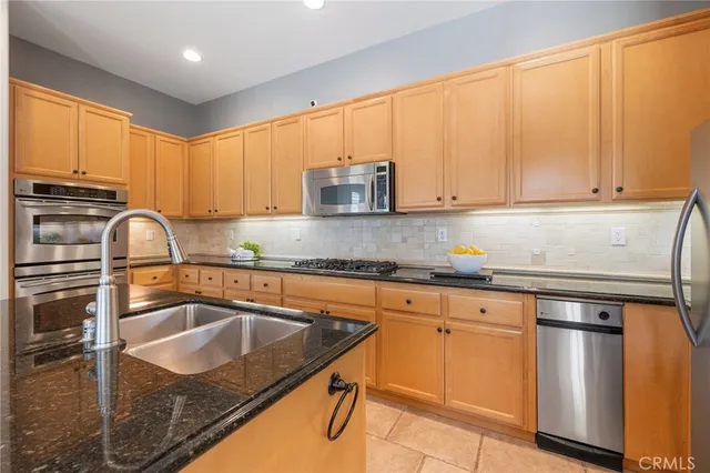 a bedroom with a bed and a chair