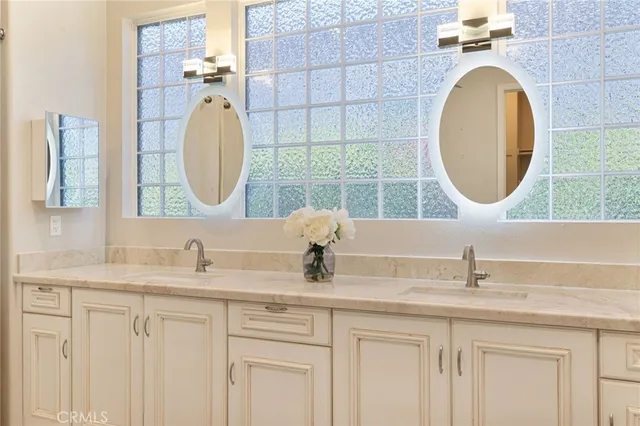 a living room with a couch and a potted plant