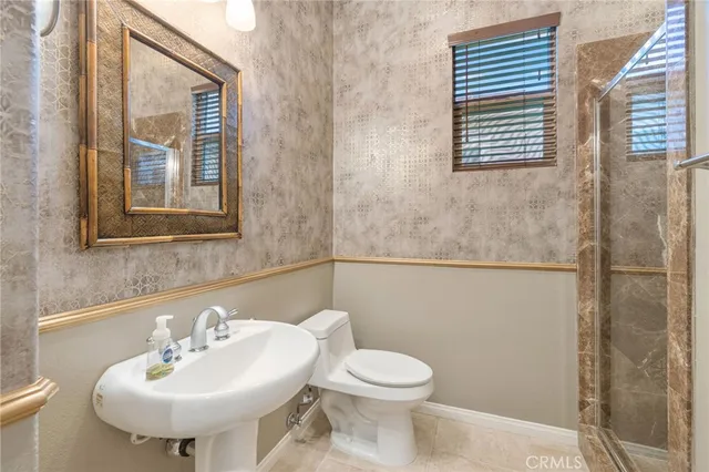 an aerial view of residential houses with outdoor space and river