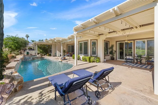 a kitchen with lots of counter top space and dining table