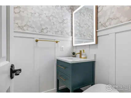 a bathroom with a sink and mirror