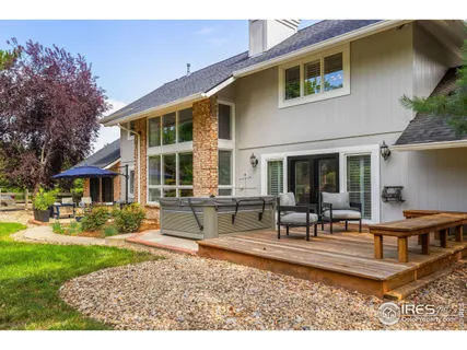 a front view of a house with swimming pool having outdoor seating