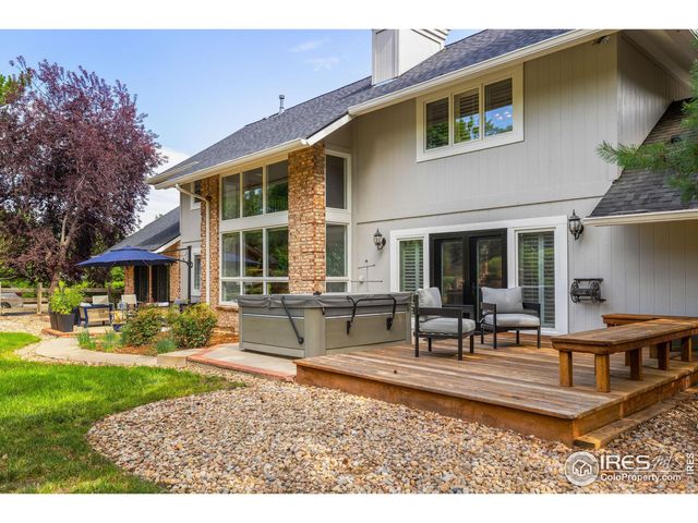 a front view of a house with swimming pool having outdoor seating
