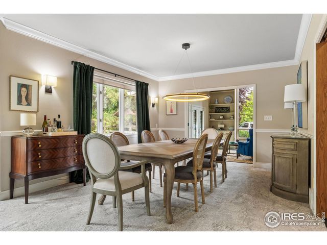 a view of a dining room with furniture and windows
