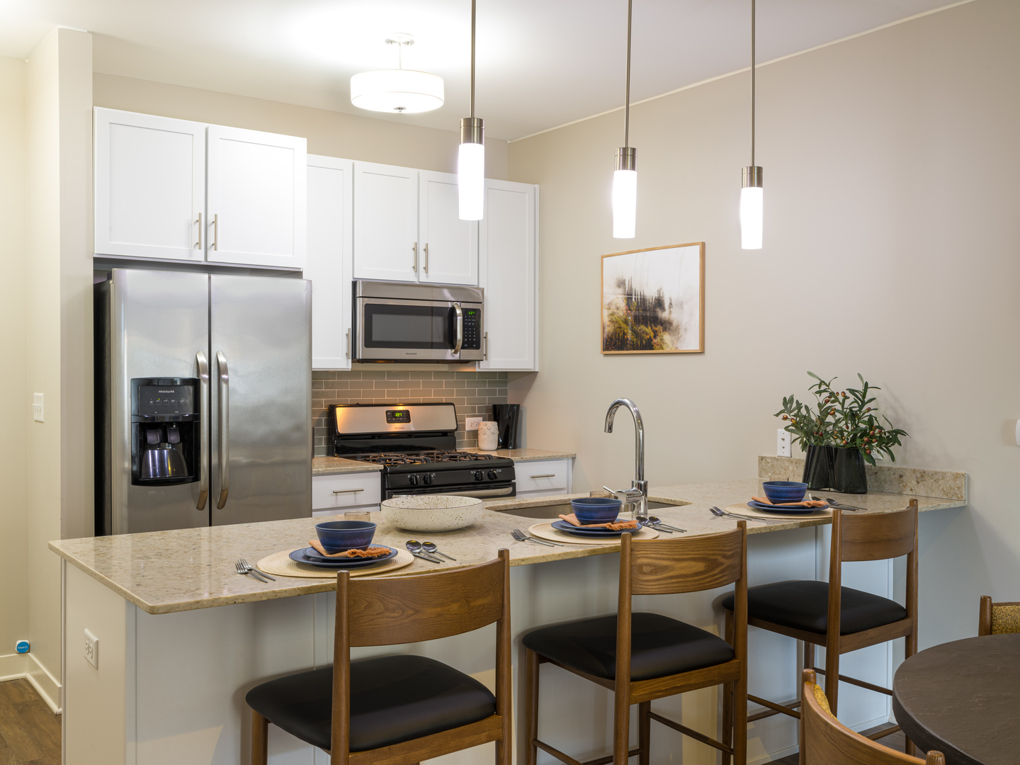 255 North Addison Avenue, Unit 208 Elmhurst, IL 60126 - Photo 3 of 19 a kitchen with a dining table chairs and refrigerator
