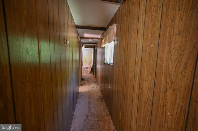 a view of a green yard with an oven and a lake