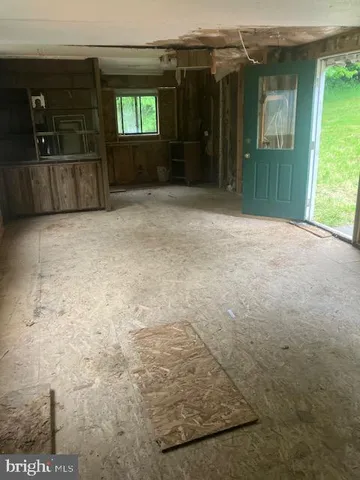 an empty room with entrance door