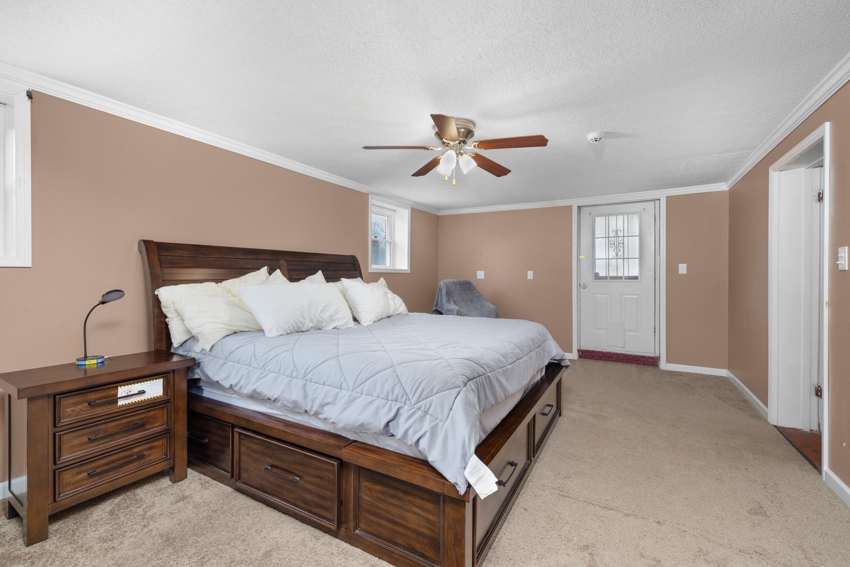 5466 Highway 59 Covington, TN 38019 - Photo 12 of 36 a spacious bedroom with a bed and a chandelier