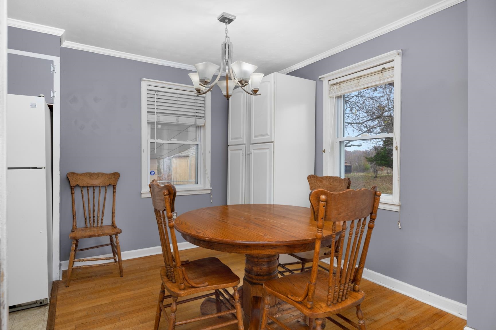 5466 Highway 59 Covington, TN 38019 - Photo 14 of 36 Dining area with light wood finished floors, a chandelier, and ornamental molding