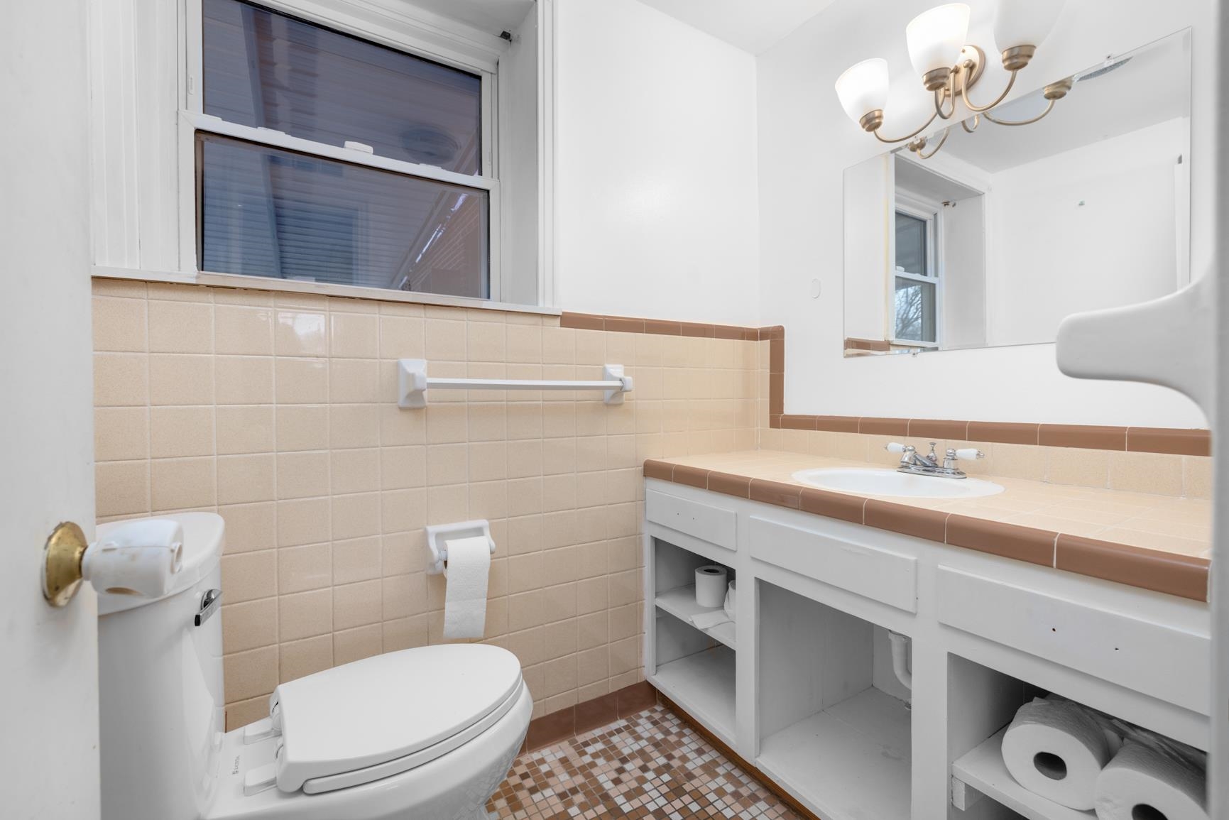5466 Highway 59 Covington, TN 38019 - Photo 14 of 36 a bathroom with a sink a toilet and mirror