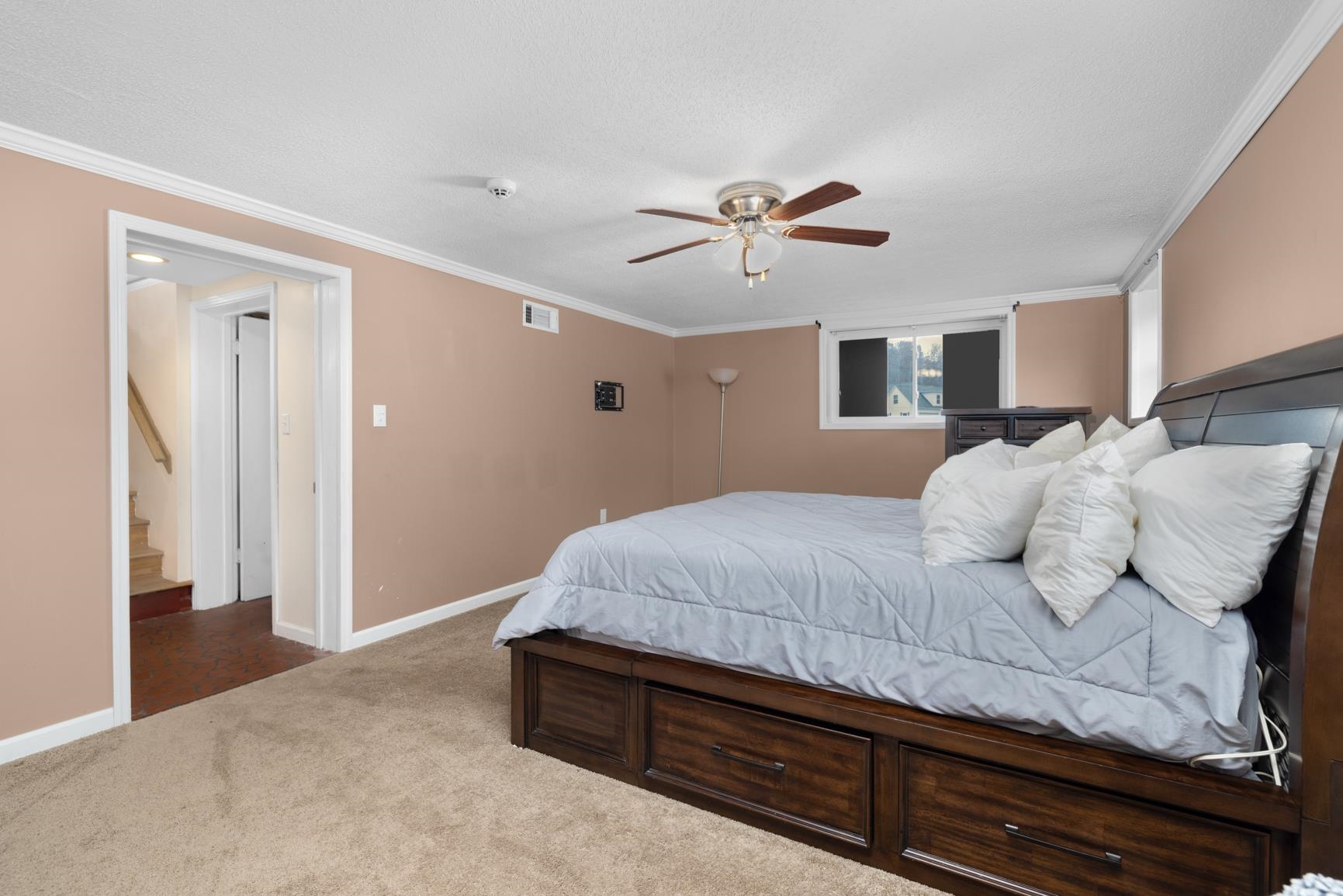 5466 Highway 59 Covington, TN 38019 - Photo 23 of 36 Bonus room with ornamental molding, light colored carpet, and a ceiling fan