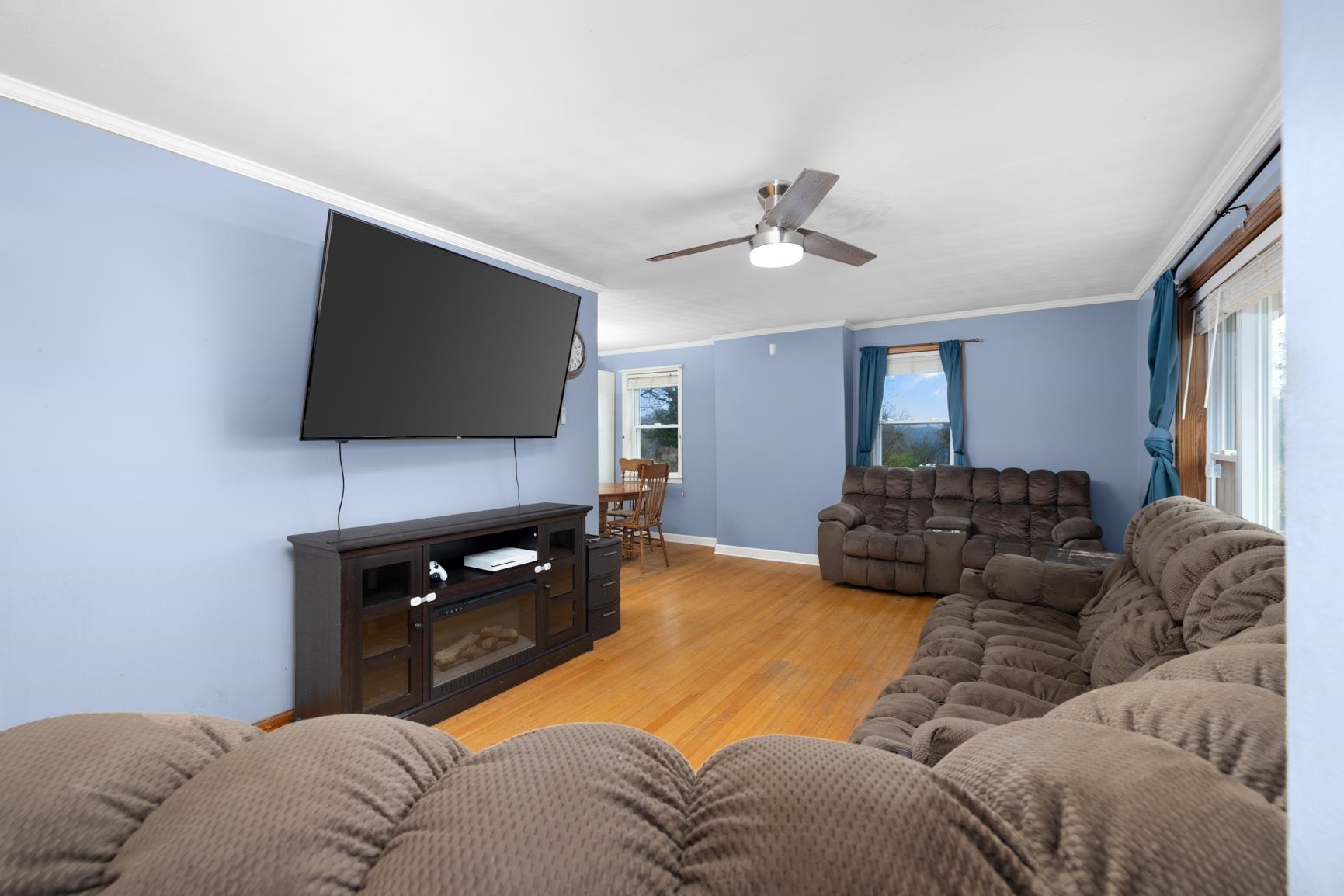 5466 Highway 59 Covington, TN 38019 - Photo 27 of 36 a living room with furniture and a flat screen tv