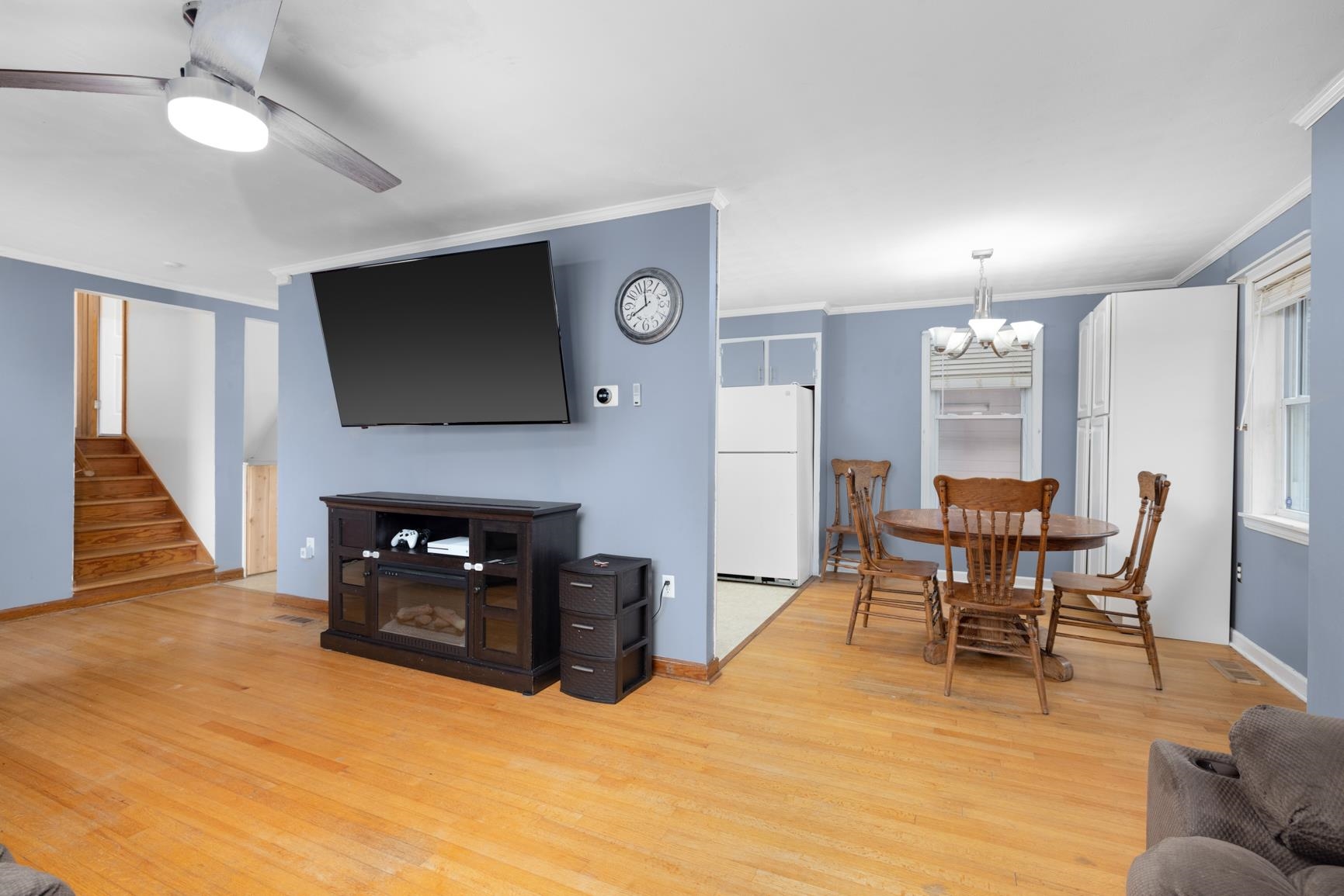 5466 Highway 59 Covington, TN 38019 - Photo 28 of 36 a living room with furniture a fireplace and a flat screen tv