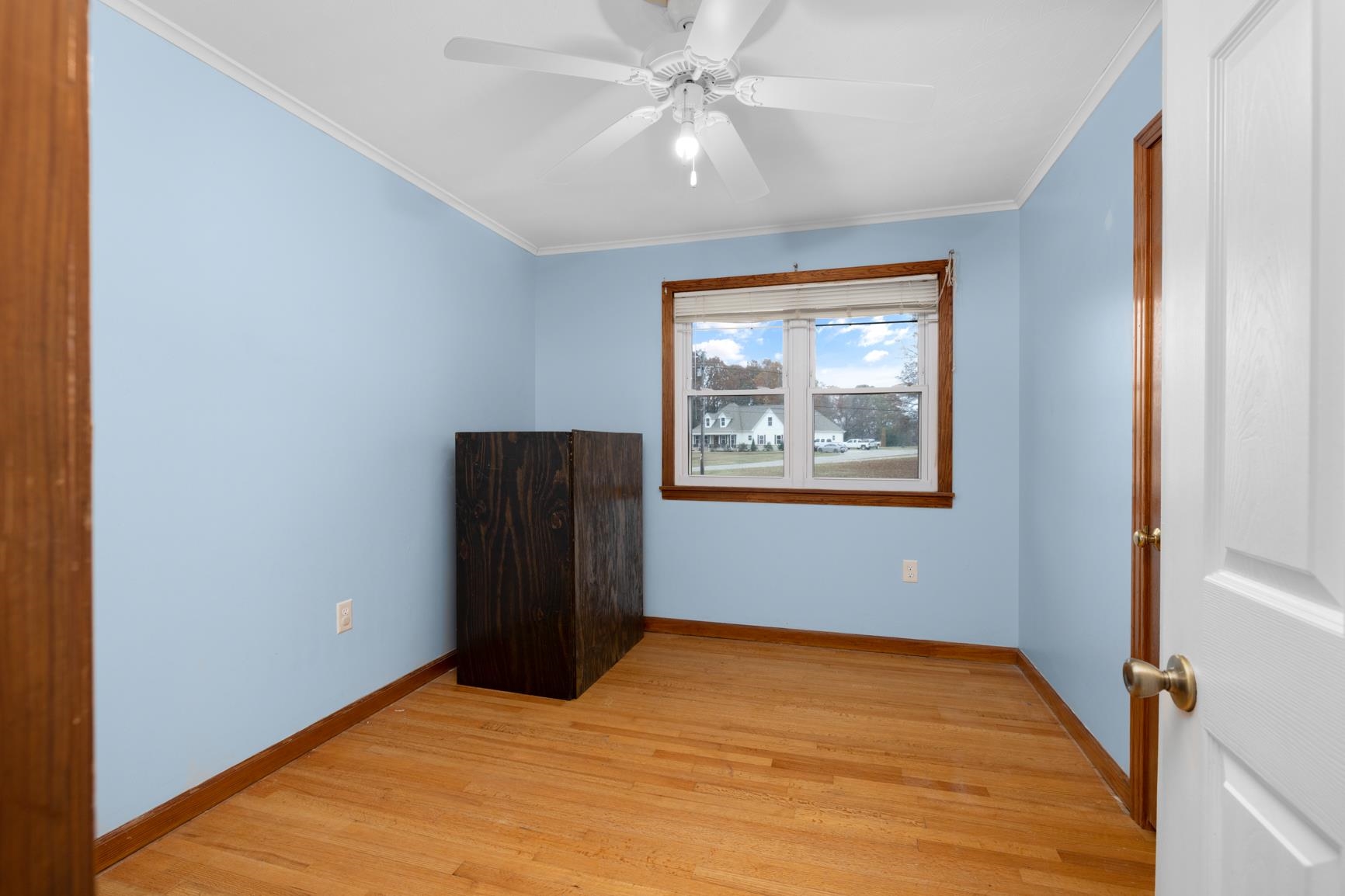 5466 Highway 59 Covington, TN 38019 - Photo 29 of 36 Empty room with light wood finished floors, crown molding, and ceiling fan