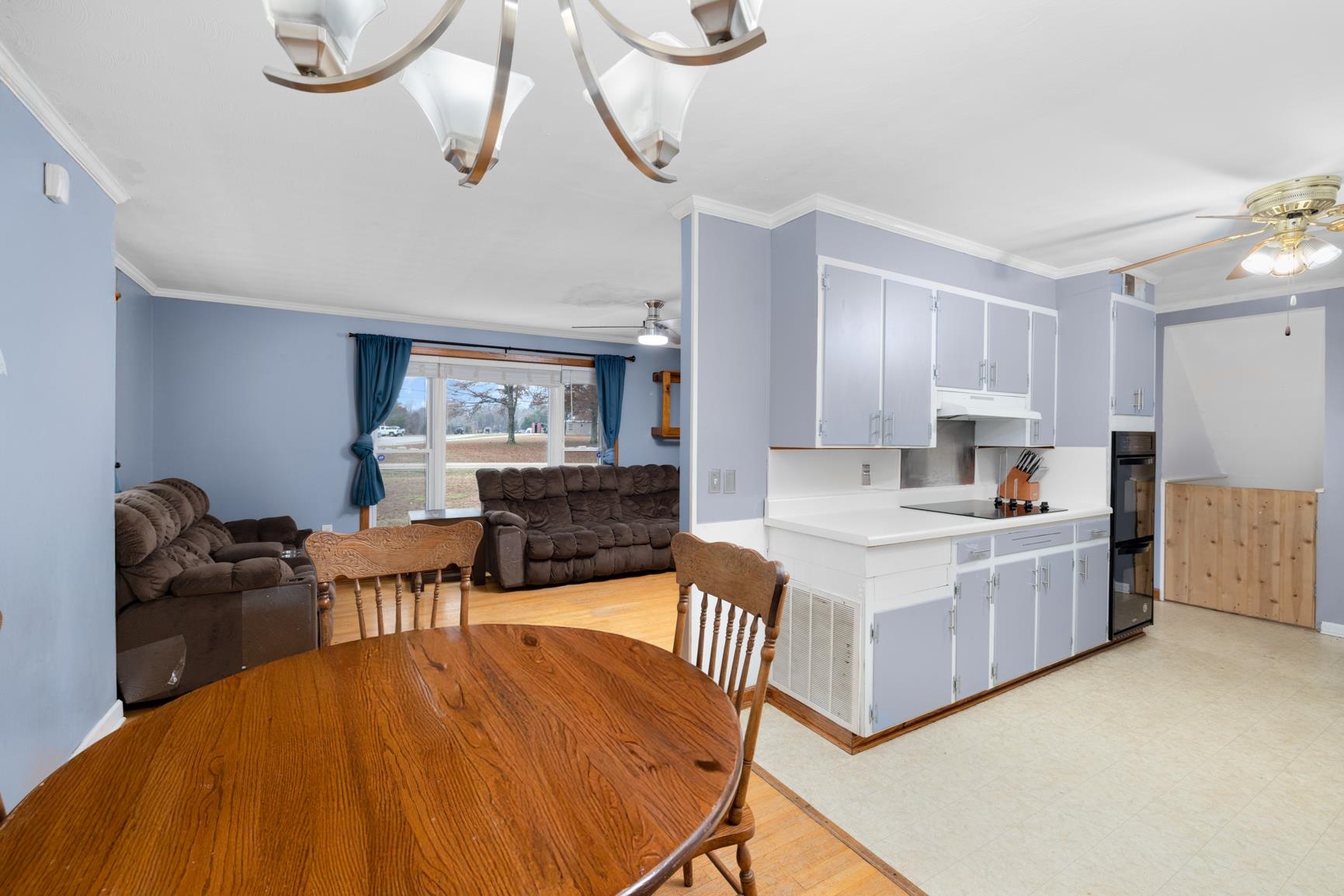 5466 Highway 59 Covington, TN 38019 - Photo 31 of 36 a living room with stainless steel appliances kitchen island granite countertop furniture and a kitchen view