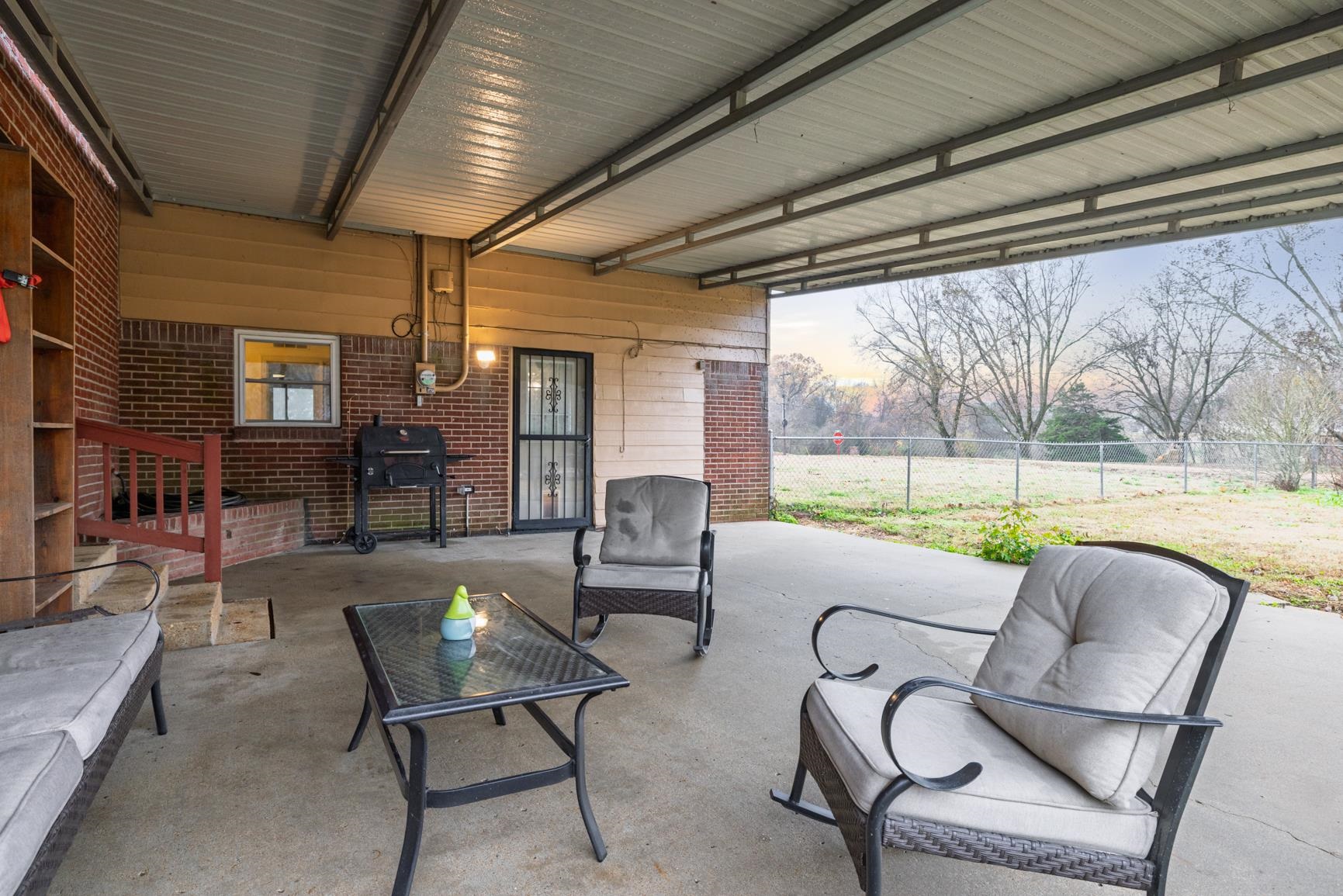 5466 Highway 59 Covington, TN 38019 - Photo 34 of 36 Patio terrace at dusk with a patio and a grill
