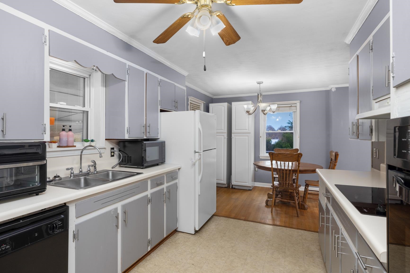 5466 Highway 59 Covington, TN 38019 - Photo 9 of 36 a kitchen with stainless steel appliances a stove a sink a refrigerator and cabinets