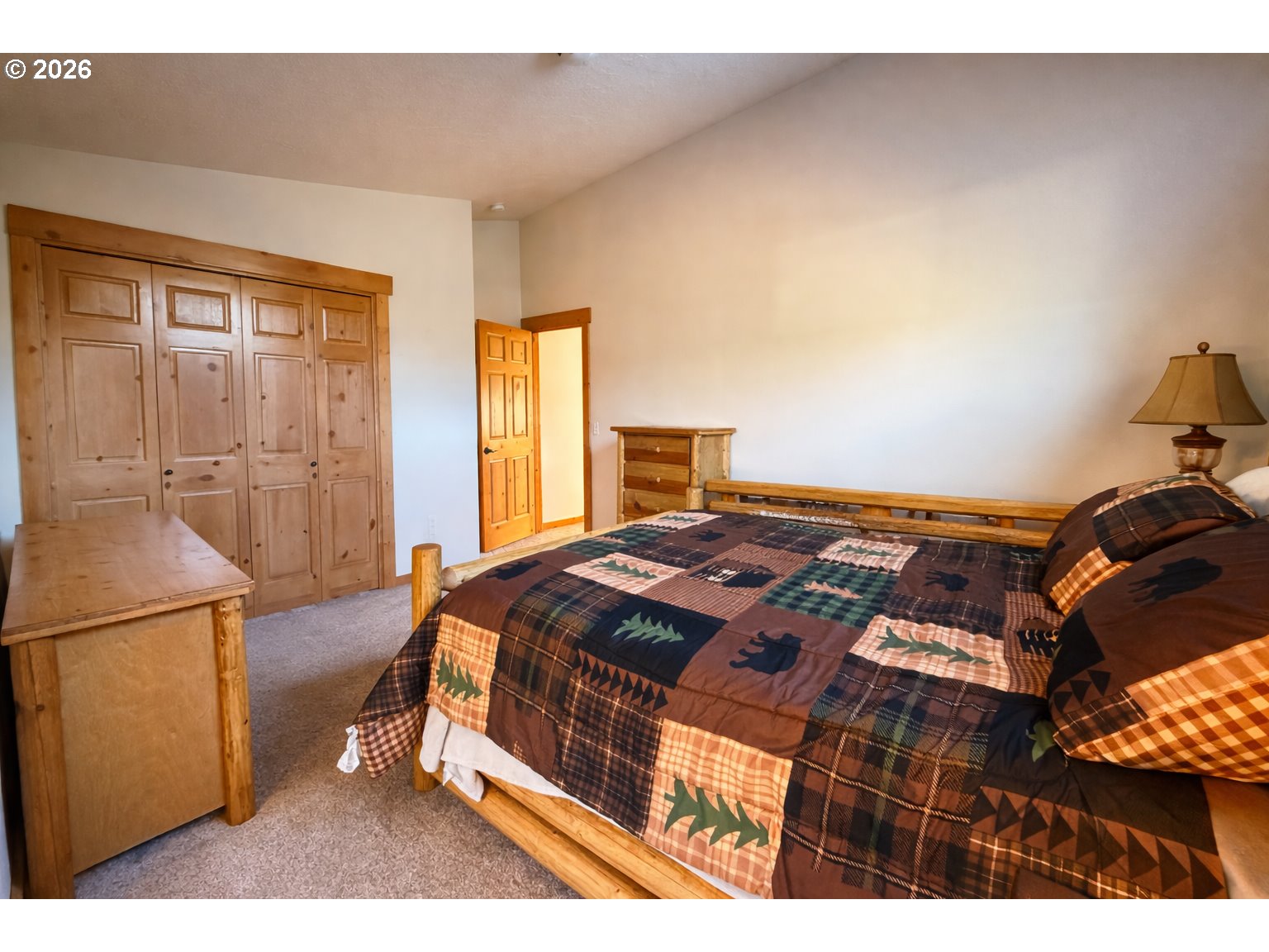 125 Melgard Court Detroit, OR 97342 - Photo 14 of 25 a bed sitting in a bedroom next to a window