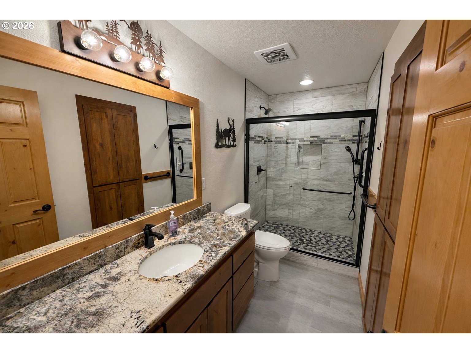 125 Melgard Court Detroit, OR 97342 - Photo 16 of 25 a bathroom with a granite countertop sink toilet and shower