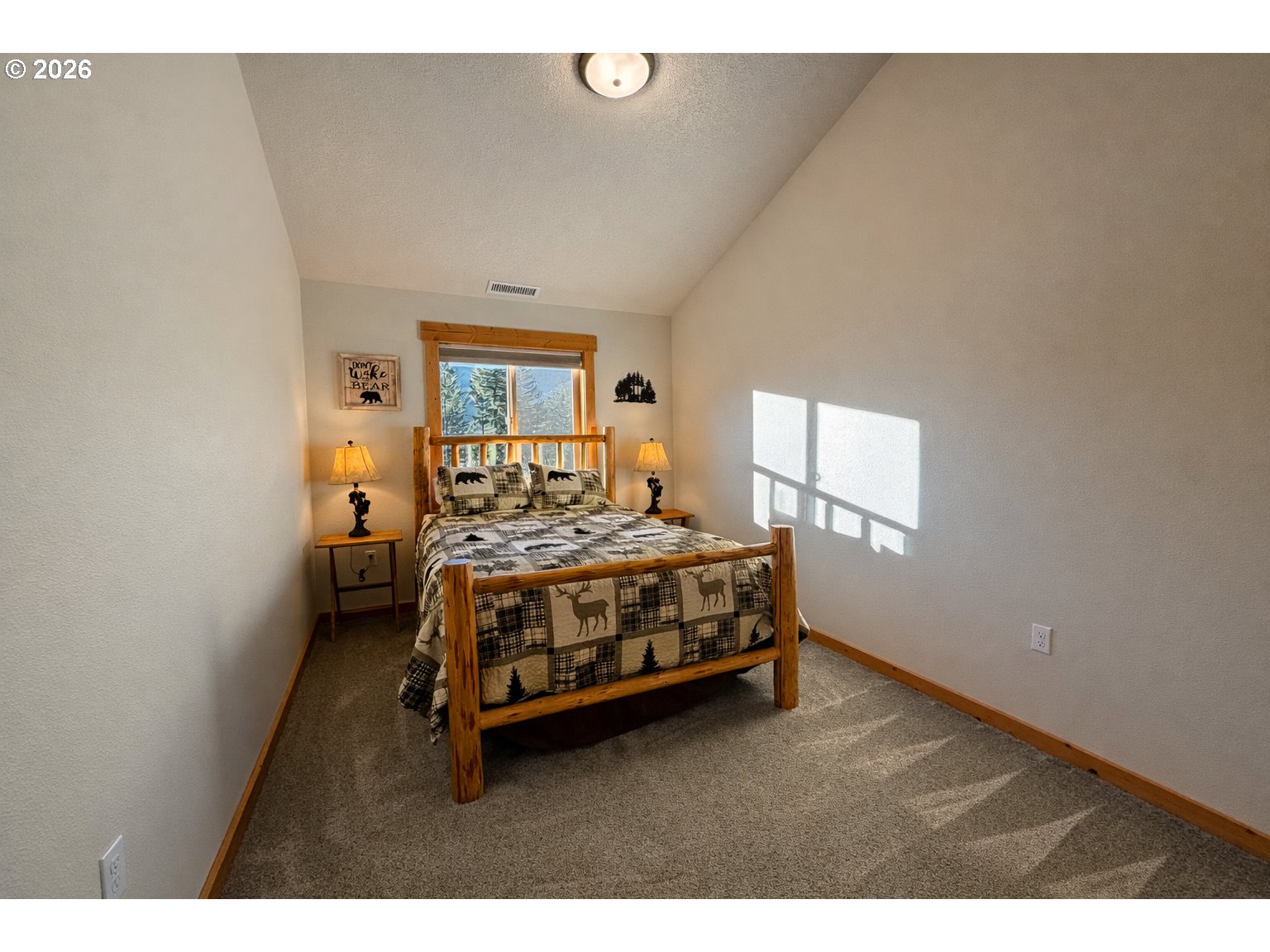 125 Melgard Court Detroit, OR 97342 - Photo 17 of 25 a bedroom with a bed and window