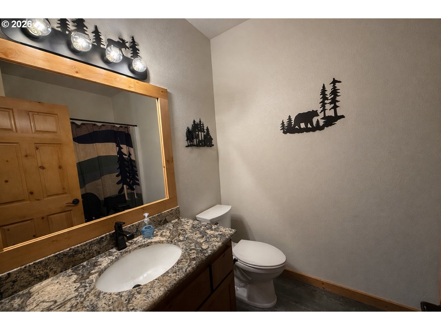 125 Melgard Court Detroit, OR 97342 - Photo 24 of 25 a bathroom with a granite countertop toilet sink and mirror
