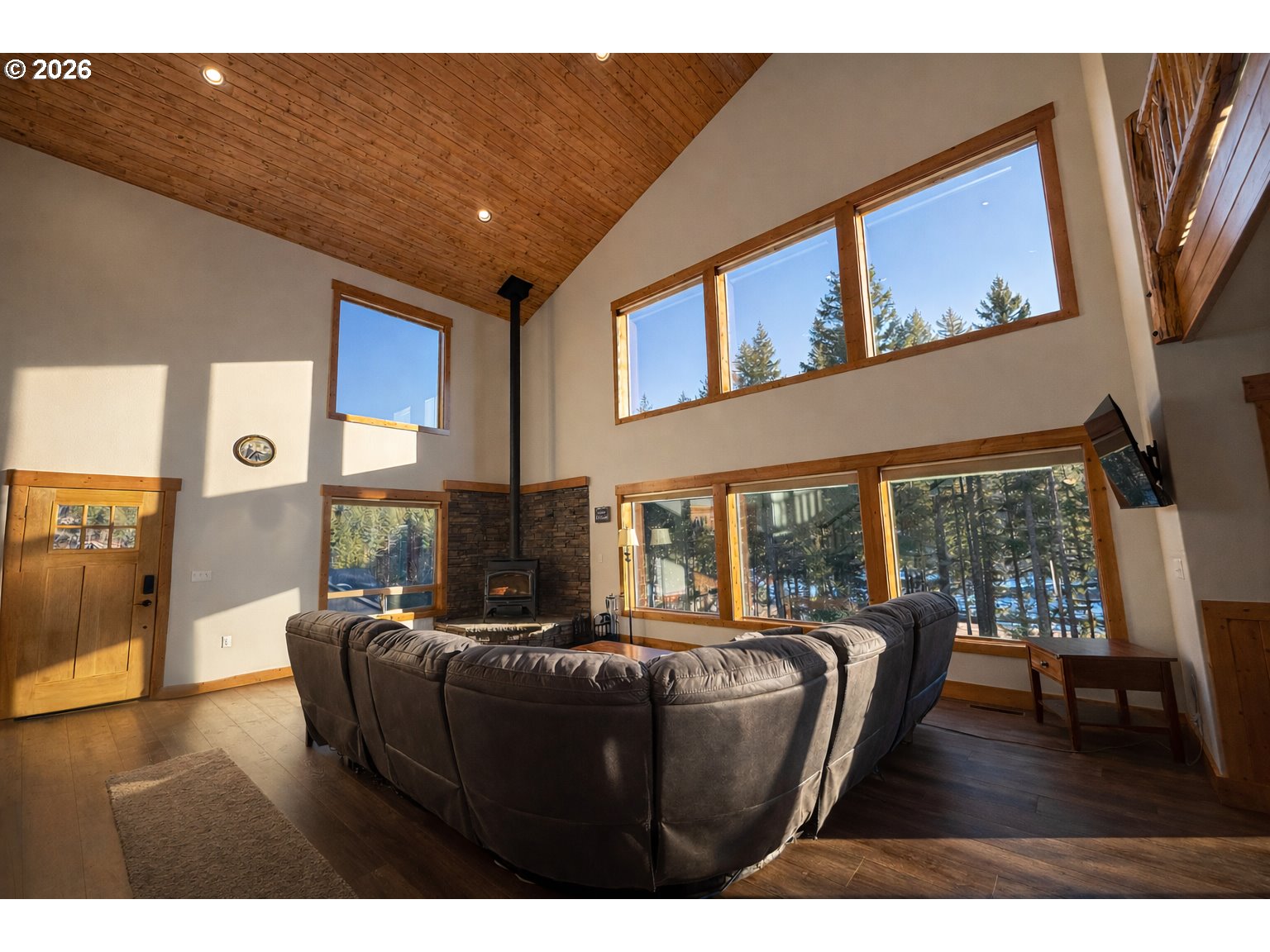 125 Melgard Court Detroit, OR 97342 - Photo 10 of 25 a living room with furniture and a floor to ceiling window