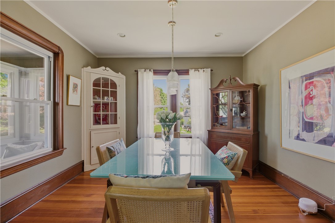 1536 Main Road Tiverton, RI 02878 - Photo 11 of 34 Dining room with built in cabinets, architectural moldings and views of harbor