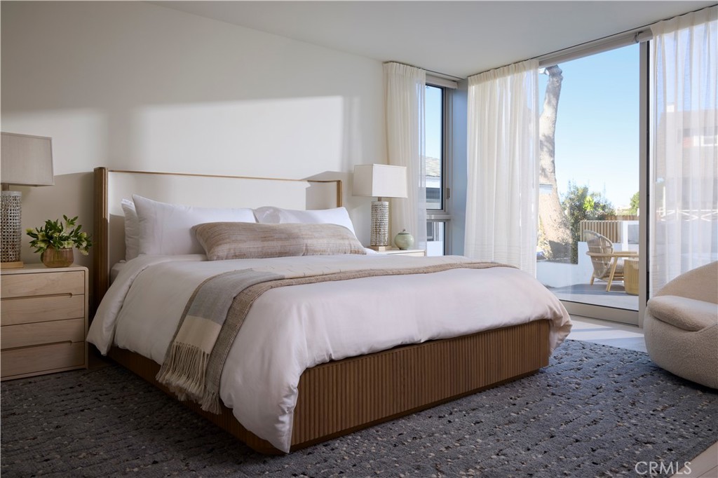 316 24th Street Hermosa Beach, CA 90254 - Photo 11 of 19 a bedroom with a bed lamp and a large window