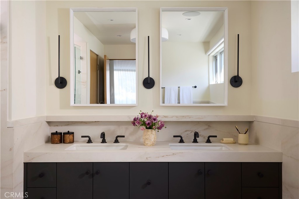316 24th Street Hermosa Beach, CA 90254 - Photo 14 of 19 a bathroom with a sink vanity and mirror