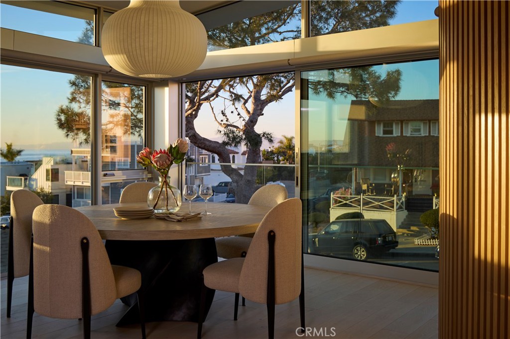316 24th Street Hermosa Beach, CA 90254 - Photo 2 of 19 a dining room with furniture a chandelier and glass door