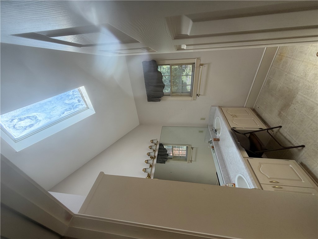715 Concord Road Anderson, SC 29621 - Photo 12 of 24 Double vanity in a sunlit primary bathroom featuring a convenient skylight.