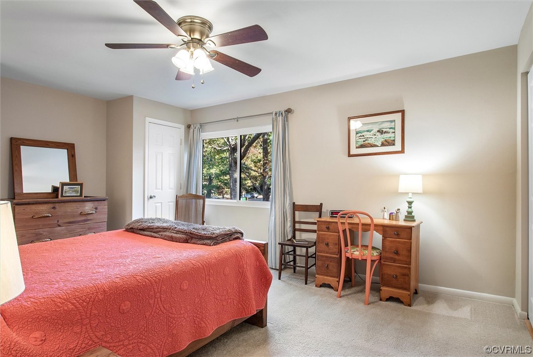 11629 East Briar Patch Drive Midlothian, VA 23113 - Photo 18 of 27 a bedroom with a bed and a chandelier