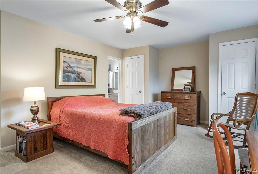 11629 East Briar Patch Drive Midlothian, VA 23113 - Photo 19 of 27 a bedroom with a bed and a chandelier