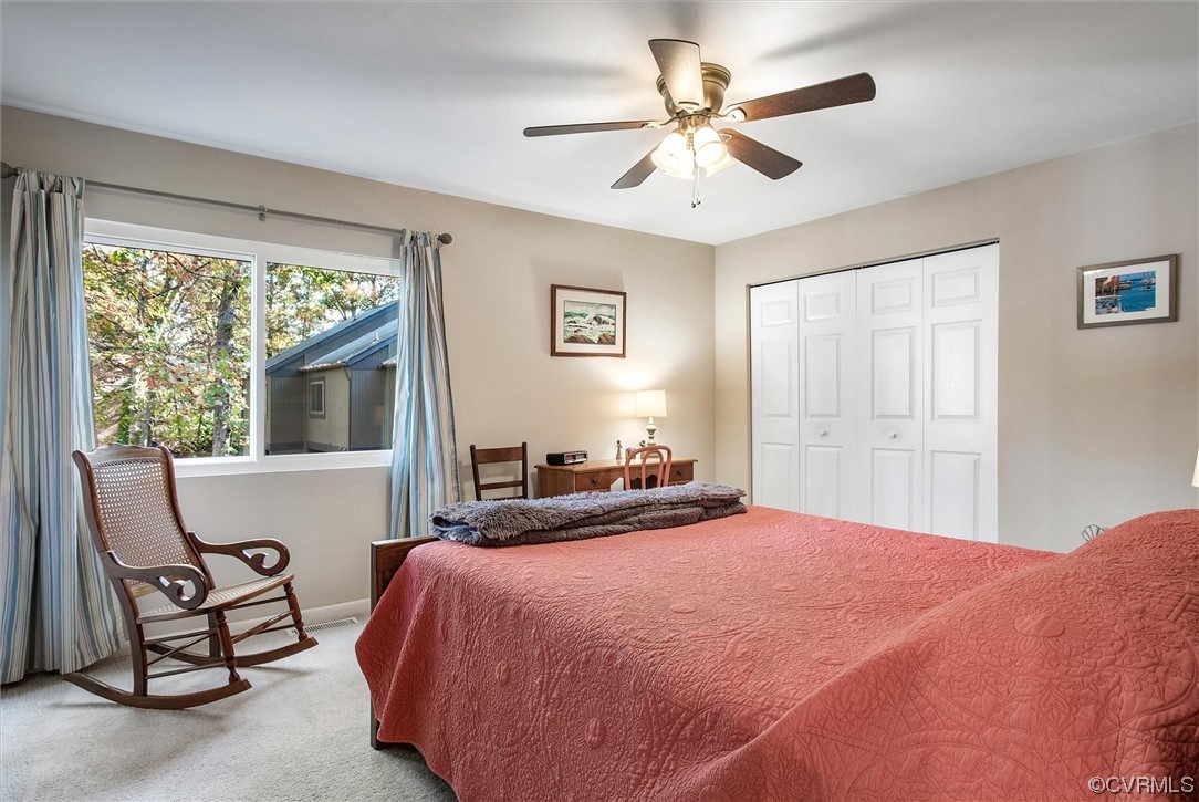11629 East Briar Patch Drive Midlothian, VA 23113 - Photo 20 of 27 a bedroom with a large bed and a large window