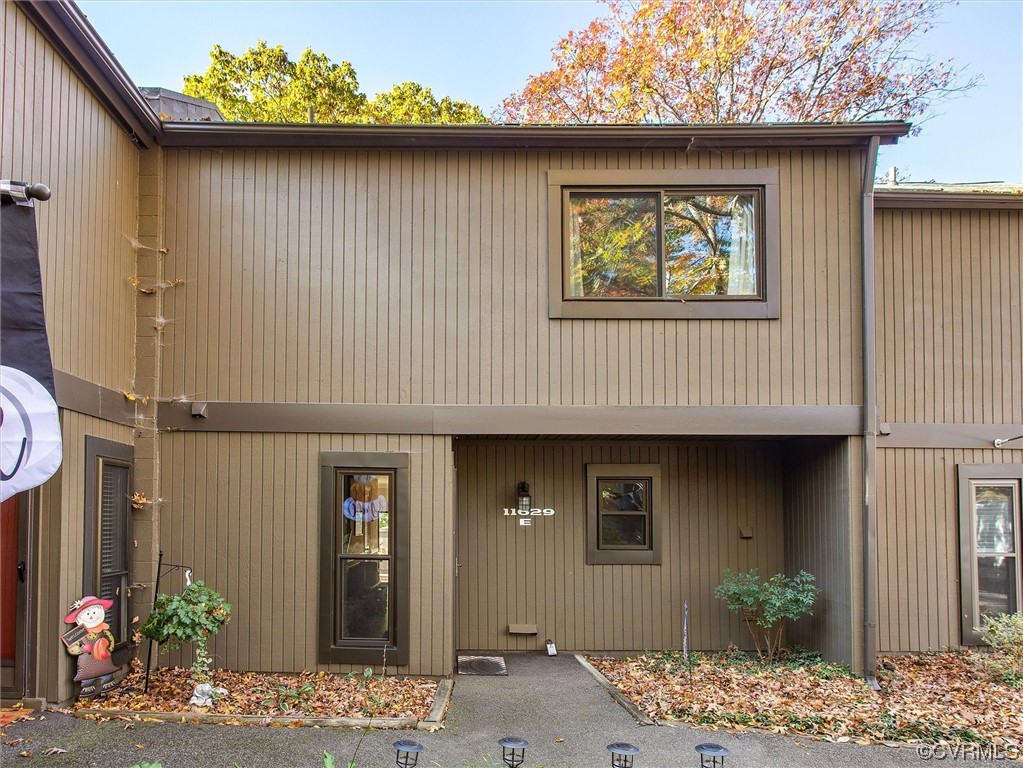 11629 East Briar Patch Drive Midlothian, VA 23113 - Photo 2 of 27 a front view of a house with a wooden fence