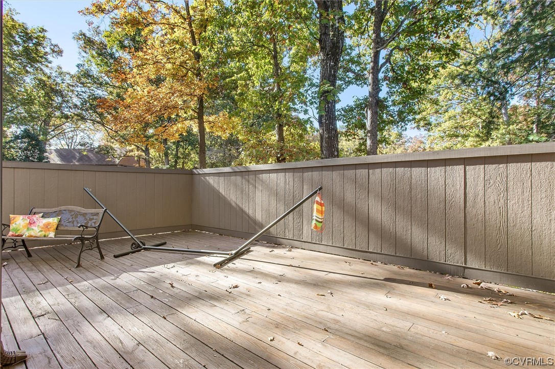 11629 East Briar Patch Drive Midlothian, VA 23113 - Photo 25 of 27 a view of a roof deck with wooden fence and a couple of chairs