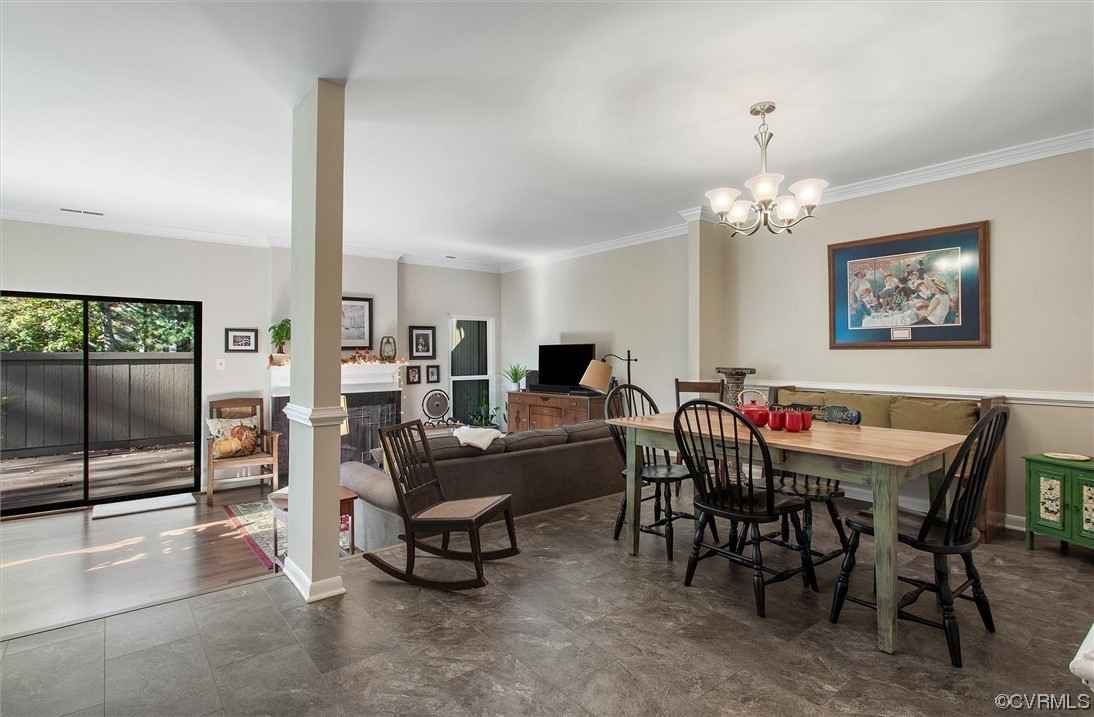 11629 East Briar Patch Drive Midlothian, VA 23113 - Photo 7 of 27 a view of a dining room with furniture and chandelier
