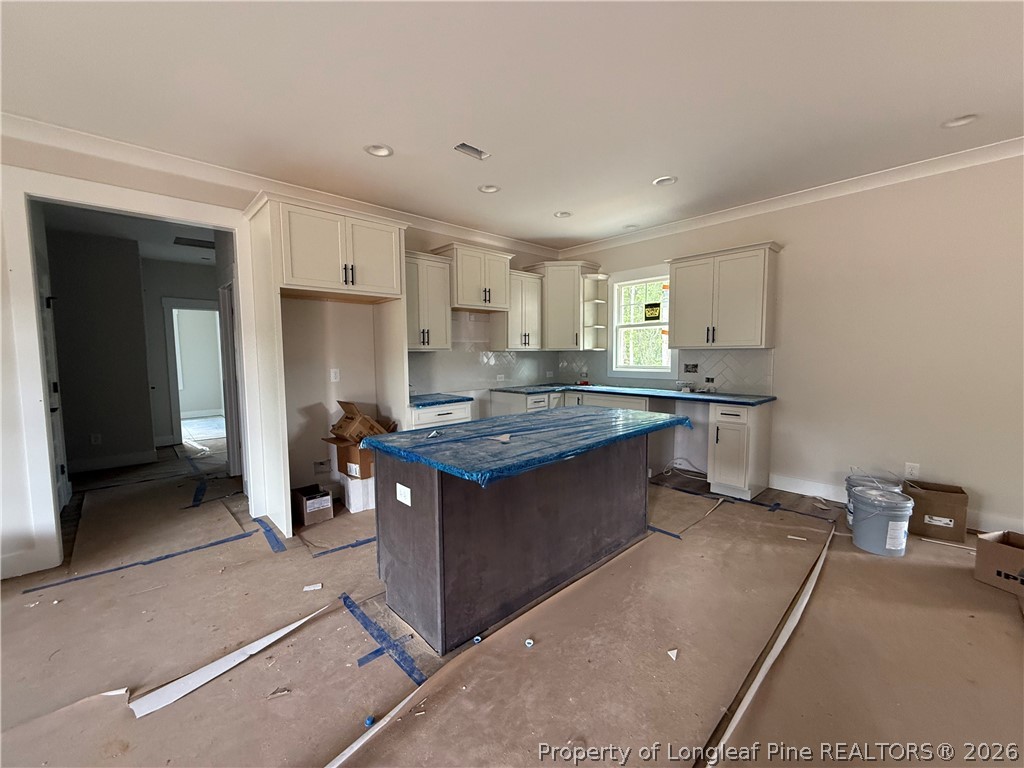 154 Ridge Stone Drive Autryville, NC 28318 - Photo 3 of 17 a kitchen with stainless steel appliances granite countertop a sink stove and refrigerator