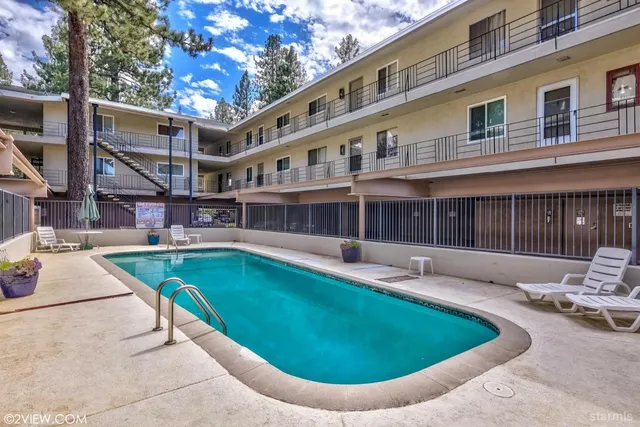 a view of a swimming pool with a lounge chairs