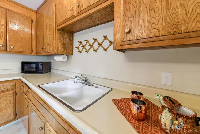 a kitchen with a sink and cabinets