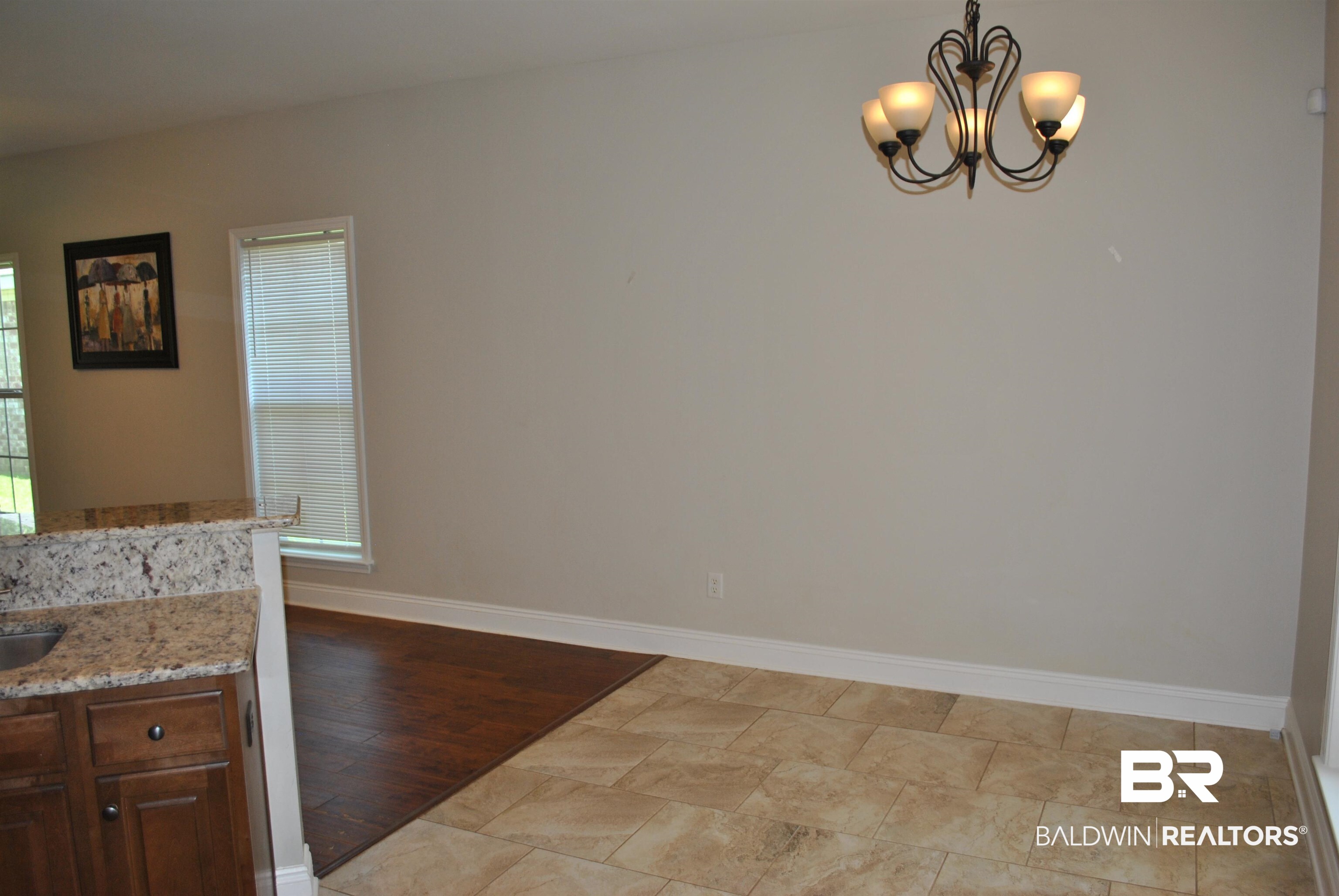 2161 Spring Grove West Mobile, AL 36695 - Photo 16 of 31 Unfurnished dining area with baseboards and a chandelier