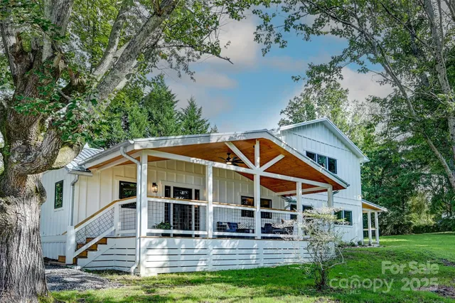a view of house with yard and entertaining space