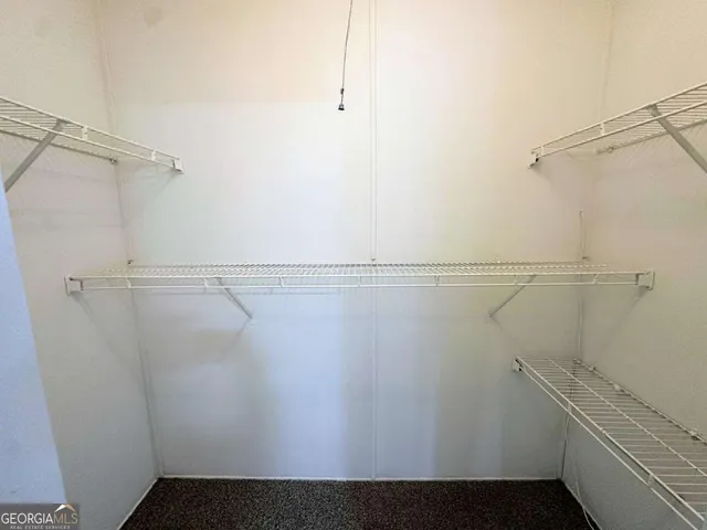 a view of a room with racks on the wall