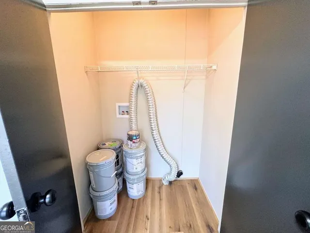 a view of swimming pool with large trees