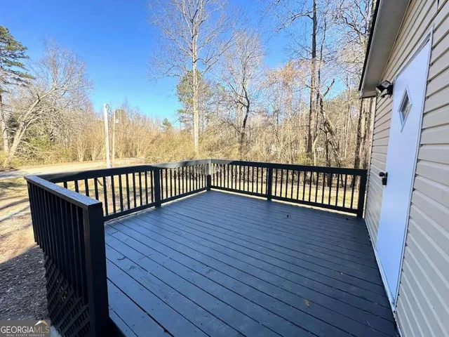 a view of balcony with wooden floor