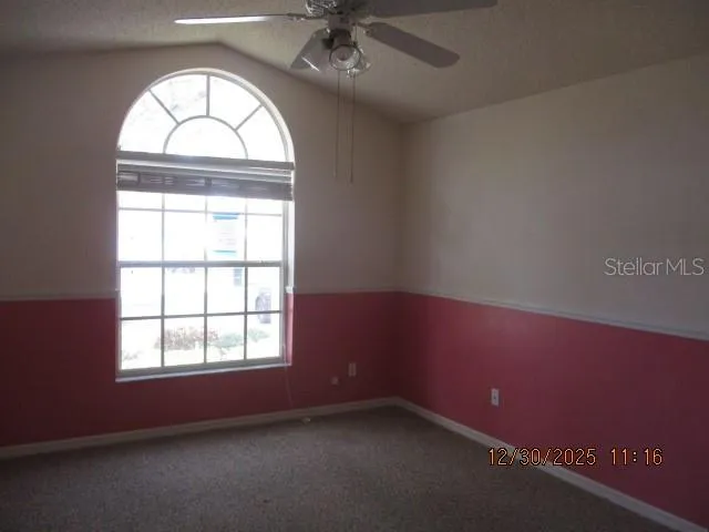 an empty room with a empty space and a window