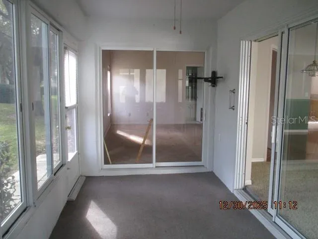 a view of a bathroom with a glass door and shower
