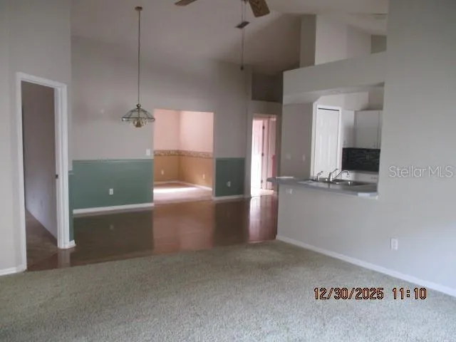 a view of a kitchen cabinets and a window