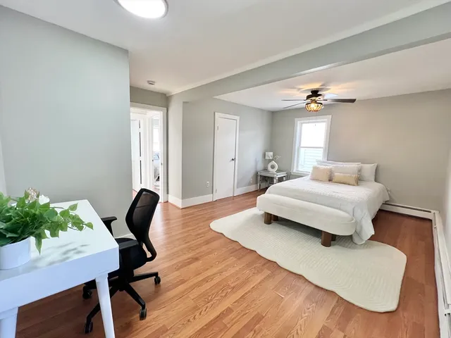 a bedroom with a bed and a table